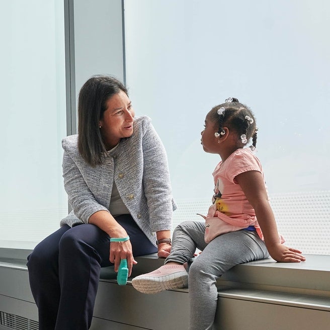 Physician talking with young patient