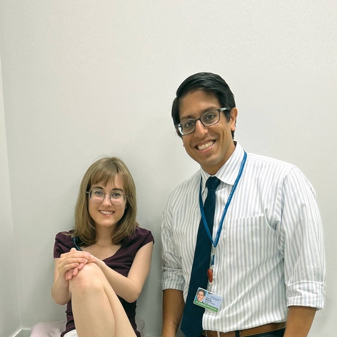 Teen patient sitting with her physican