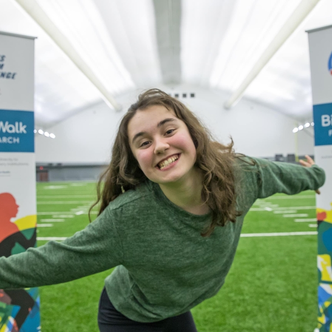 CHOP patient smiling at the Eagles Autism Challenge event