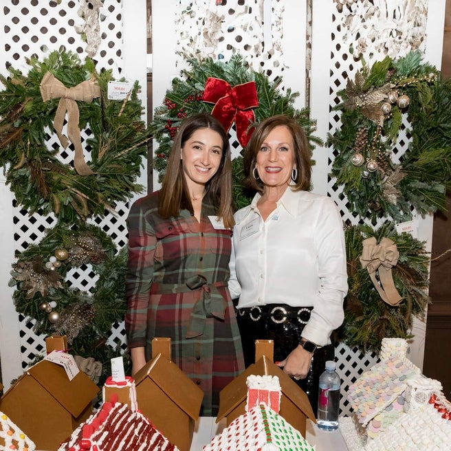 Participants smiling at the Holiday Boutique