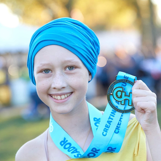 Parkway ambassador holding her medal