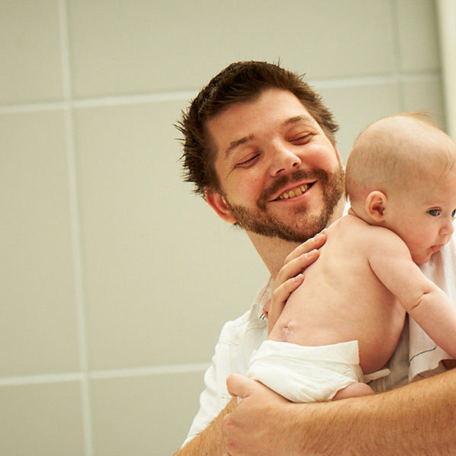 Dad holding his baby.