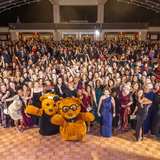 Black Tie Tailgate 2023 group at event with Clutch the Bear