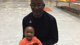 baby and granddad in pool smiling