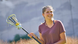 Lucy practicing lacrosse