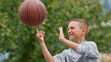 Ty spinning a basketball on his finger