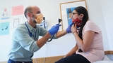 Doctor with patient in exam room