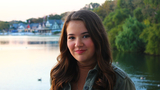 Emily IBD patient outside smiling at boathouse row