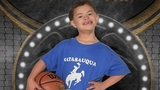 Roman smiling with a basketball