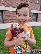 Roman smiling with a stuffed lion