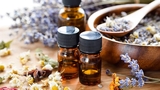 Aromatherapy oil bottles and flowers