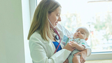 Pediatrician with infant