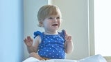 Baby smiling in doctor's office