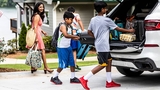 family loading up car for vacation