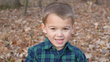 Jeremy outside in the fall smiling