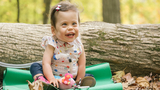 Josephine smiling sitting outside