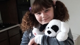 Young girl hospital patient smiling holding stuffed animal