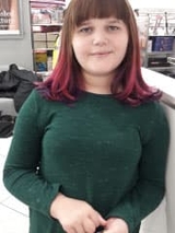 Young girl hospital patient smiling in store