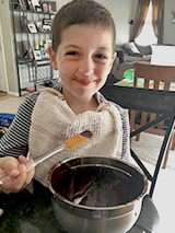 Dominic holding chocolate baking spoon