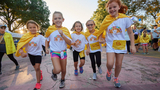 kids running towards camera smiling