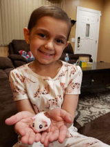 girl holding toy