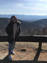 girl standing in front of canyon