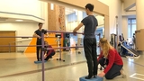 Teen ballet dancer doing stretches