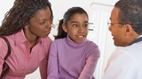 Doctor talking to patient and mother