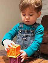 Beau playing with building blocks