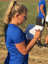 Sydney as team manager on the soccer field