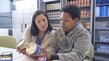 Young teen reading food labels with specialist