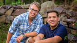 Tyler and Jake sitting outside on rocks