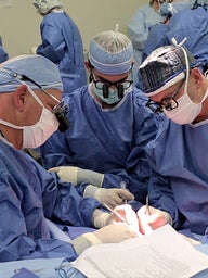 Surgeons Performing Hand Transplant Surgery