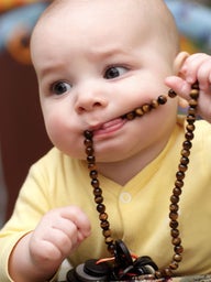 baby with beads