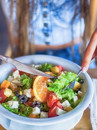 young woman eating salad