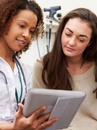 nurse and patient talking