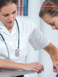 Doctor examining a child's stomach