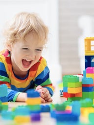 child playing with blocks