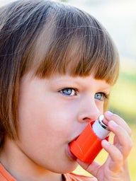 little girl with inhaler