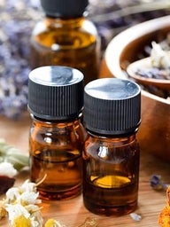 Aromatherapy oil bottles and flowers