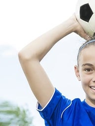 GIrl holding soccer ball