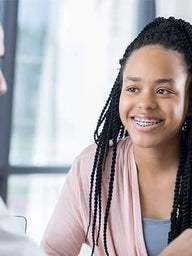 Doctor talking to teen patient