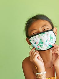 Young girl wearing a protective mask