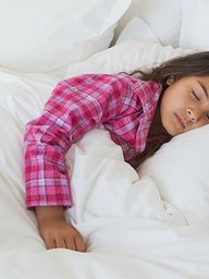 Older female toddler sleeping in bed