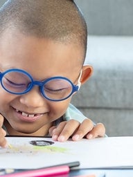 Young boy drawing a picture