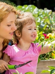 Mother and daughter in the garden