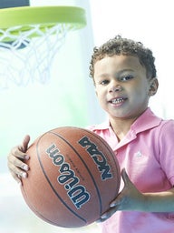 Young boy holding a basketball