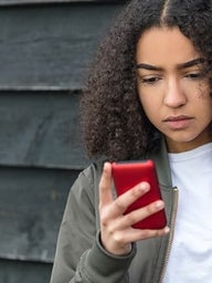 Teen girl looking at her smartphone