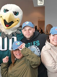 Group photo with Eagles mascot, Swoop