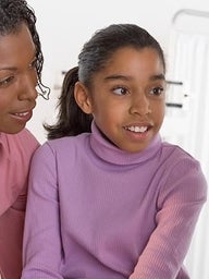 Doctor talking to patient and mother